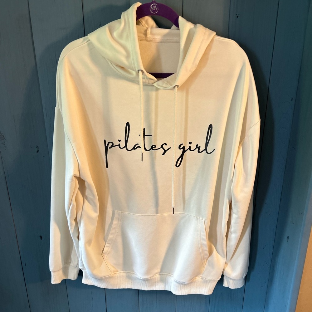 NWOT Amazon Cream Hoodie w/Black Lettering “Pilates Girl” | Size Large